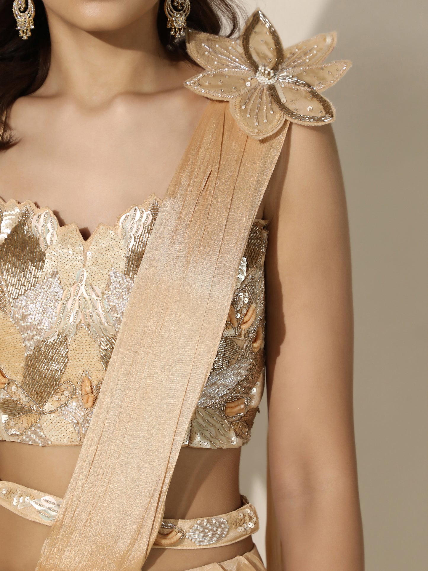 Gold Crushed Crepe Drape Saree with Cutwork Blouse and Flower Brooch on Shoulder