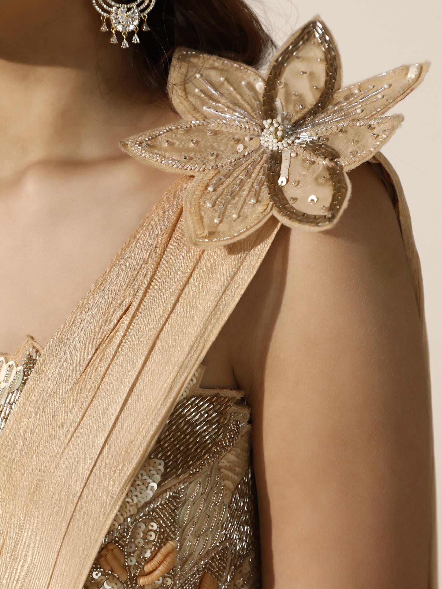 Gold Crushed Crepe Drape Saree with Cutwork Blouse and Flower Brooch on Shoulder