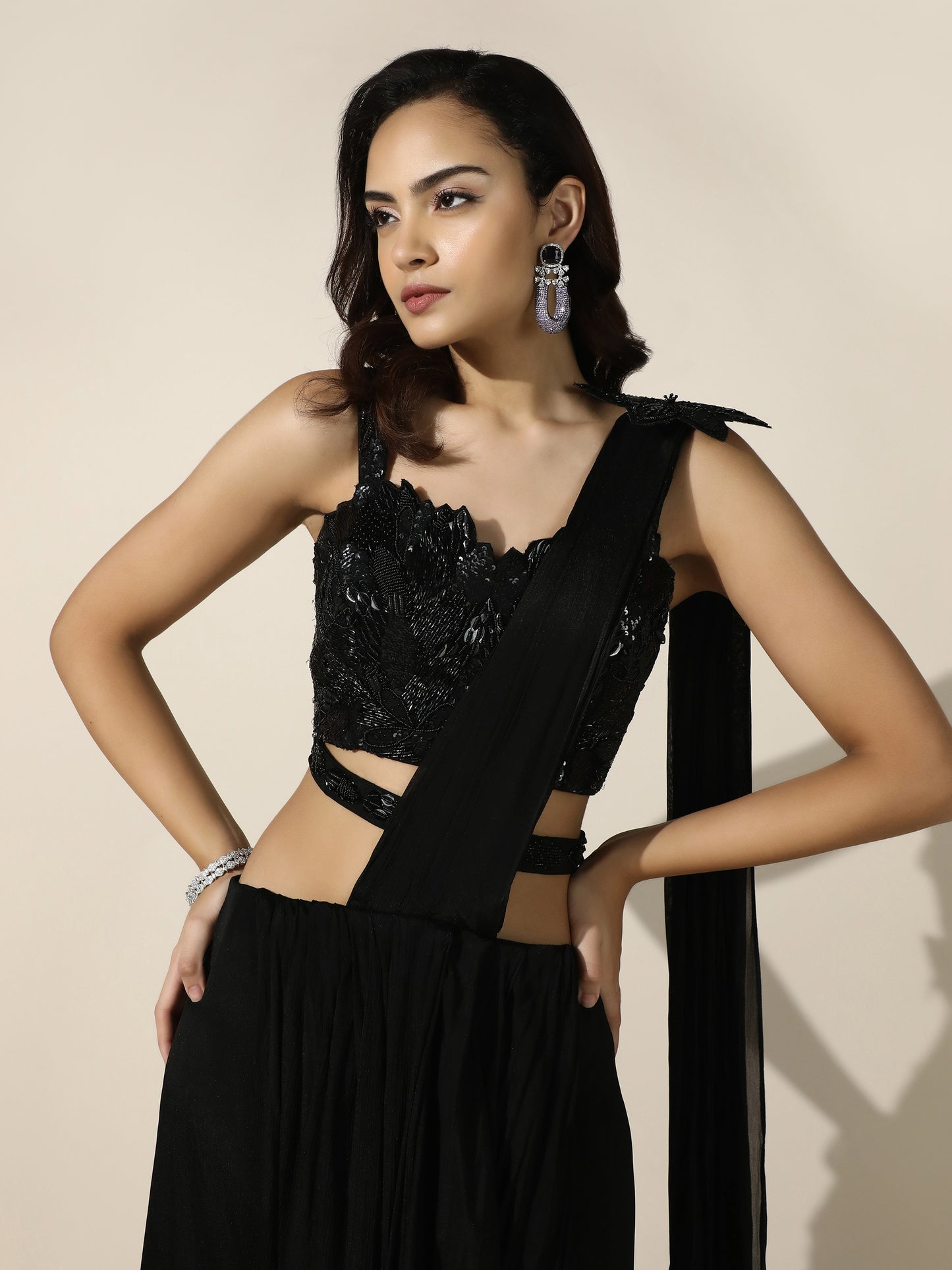 Black Crushed Crepe Drape Saree with Cutwork Blouse and Flower Brooch on Shoulder