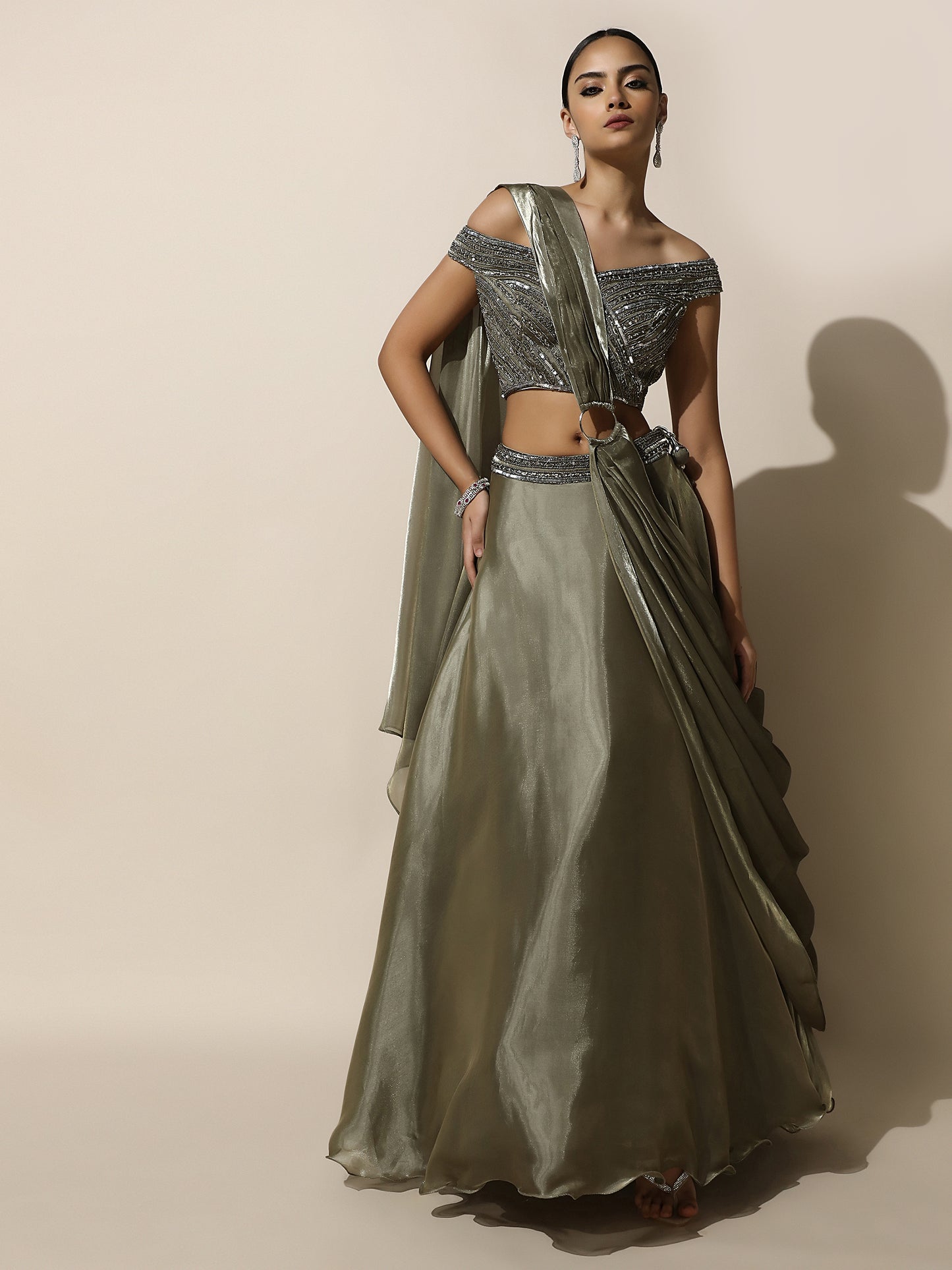 Olive Green Off-Shoulder Lehenga with Pleated Shoulder Drape, Antique Embroidery and Ring Detail