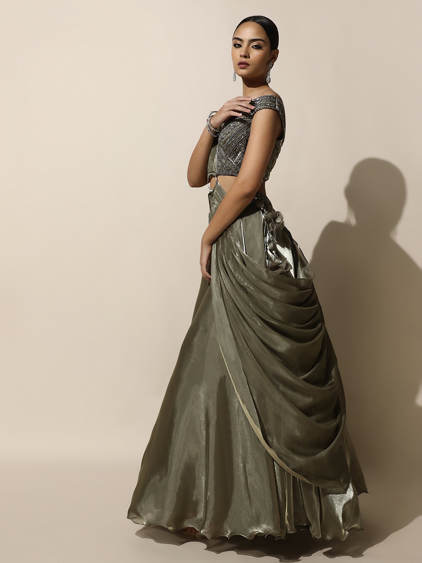 Olive Green Off-Shoulder Lehenga with Pleated Shoulder Drape, Antique Embroidery and Ring Detail
