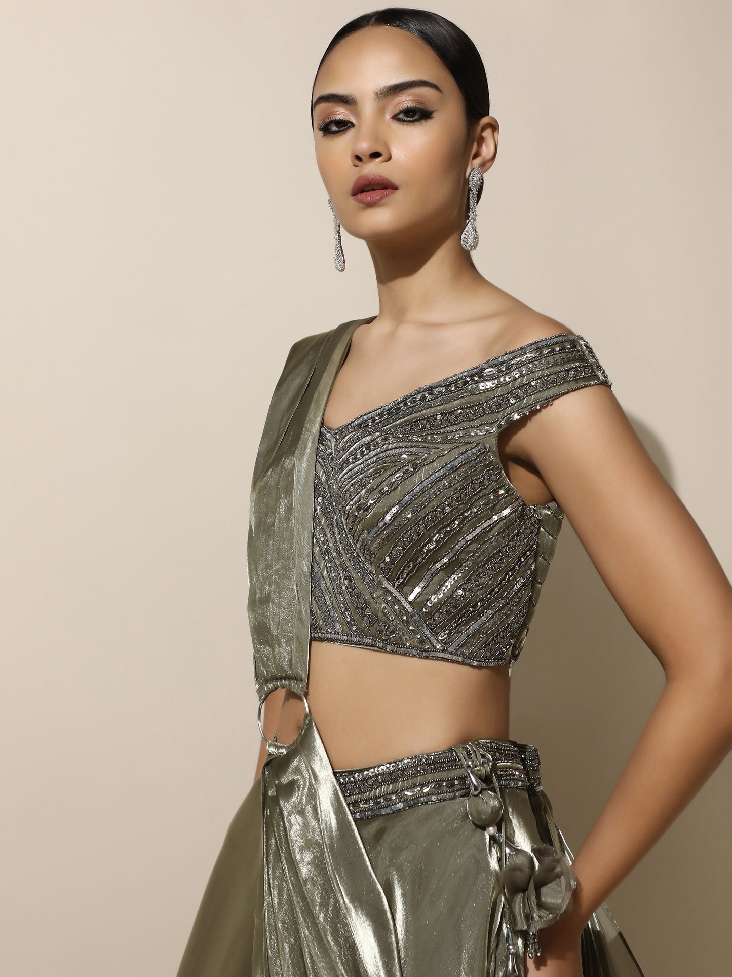 Olive Green Off-Shoulder Lehenga with Pleated Shoulder Drape, Antique Embroidery and Ring Detail