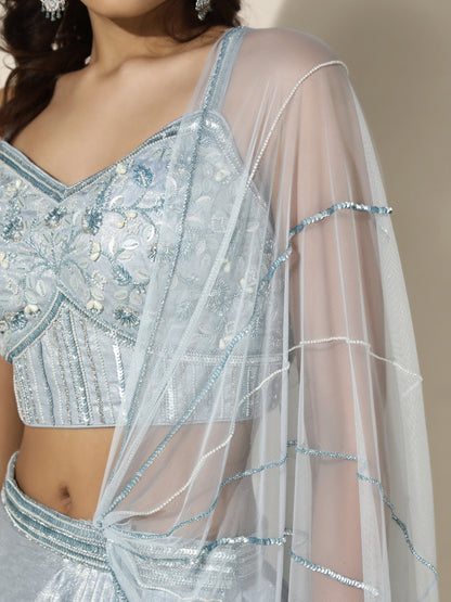 Sky Blue Shimmer Drape Saree with Corset Blouse and Sheer Shoulder Drape